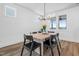 Bright dining room featuring modern light fixture, table, and chairs at 304 Rivella Dr, Wake Forest, NC 27587