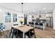 Bright dining area featuring modern light fixtures and an inviting atmosphere at 304 Rivella Dr, Wake Forest, NC 27587