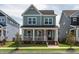 Charming two-story home featuring a welcoming front porch and well-maintained lawn at 304 Rivella Dr, Wake Forest, NC 27587