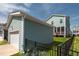 Home exterior showcasing a garage and lush backyard with privacy fence at 304 Rivella Dr, Wake Forest, NC 27587