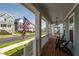 Charming front porch with wooden floors and neighborhood views at 304 Rivella Dr, Wake Forest, NC 27587