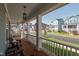 Relaxing front porch with comfortable seating and neighborhood views at 304 Rivella Dr, Wake Forest, NC 27587