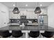 Kitchen showcasing a gray island, stainless steel appliances, and stylish pendant lighting at 304 Rivella Dr, Wake Forest, NC 27587
