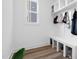 Organized mudroom featuring built-in shelves, coat hooks, and convenient bench seating at 304 Rivella Dr, Wake Forest, NC 27587