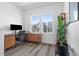 Bright office space with modern desk, sleek chair, and natural light streaming through the large window at 304 Rivella Dr, Wake Forest, NC 27587