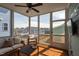 Cozy screened porch with comfortable seating, ceiling fan and outdoor view at 304 Rivella Dr, Wake Forest, NC 27587