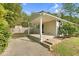 The house features a covered back patio with concrete steps and a view of the yard at 3332 Apache Dr, Raleigh, NC 27609