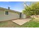 The backyard features mature trees, lawn and a patio at 3332 Apache Dr, Raleigh, NC 27609