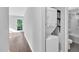 Hallway leads to a bathroom and laundry, with a washing machine and dryer on the right, and a full bathroom on the right at 3332 Apache Dr, Raleigh, NC 27609
