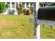 Mailbox with clear house numbers in front of a well-maintained lawn and home at 3332 Apache Dr, Raleigh, NC 27609