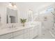 Spacious bathroom featuring double sinks, white cabinetry, and a separate glass-enclosed shower at 430 Wyndham Dr, Chapel Hill, NC 27516