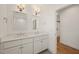 Bathroom featuring double vanity, quartz countertops, stylish lighting, and open doorway to shower at 430 Wyndham Dr, Chapel Hill, NC 27516
