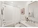 Bright bathroom featuring a shower-tub combination with white subway tile and modern fixtures at 430 Wyndham Dr, Chapel Hill, NC 27516