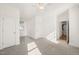 Spacious bedroom featuring plush neutral carpet, ample natural light, and closet with door at 430 Wyndham Dr, Chapel Hill, NC 27516