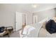 Cozy bedroom with plush carpet, a ceiling fan, and doors leading to closet space and other rooms at 430 Wyndham Dr, Chapel Hill, NC 27516
