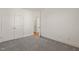 Bright bedroom featuring neutral carpet, white walls, and closet with double doors at 430 Wyndham Dr, Chapel Hill, NC 27516