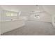 Expansive bonus room with neutral carpet, bright natural light, and versatile layout at 430 Wyndham Dr, Chapel Hill, NC 27516