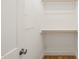 Efficiently designed closet with built-in shelving and hanging rods for maximum storage at 430 Wyndham Dr, Chapel Hill, NC 27516