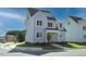Attractive exterior view of a light blue two-story house with well-kept landscaping, situated on a corner lot at 430 Wyndham Dr, Chapel Hill, NC 27516
