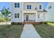 Welcoming front entrance with a brick-lined porch and a neatly landscaped yard, showcasing the home's curb appeal at 430 Wyndham Dr, Chapel Hill, NC 27516