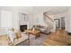 Bright living room featuring a cozy fireplace, stylish furnishings, and an inviting atmosphere for relaxation and gatherings at 430 Wyndham Dr, Chapel Hill, NC 27516