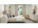 Cozy bedroom with natural light, minimalist décor, and stylish furnishings, creating a serene and inviting space at 456 Barnes Landing Dr # 39, Four Oaks, NC 27524