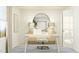 Bright home office featuring a modern desk setup, round mirror, and ample natural light for a productive workspace at 456 Barnes Landing Dr # 39, Four Oaks, NC 27524