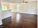 Spacious living room with dark hardwood floors, bright natural light, and open concept layout at 4616 Silverdene St, Raleigh, NC 27616