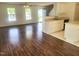 Inviting living room with hardwood floors next to the bright kitchen and a large window at 4616 Silverdene St, Raleigh, NC 27616