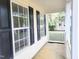 View of the porch showcasing the columns and a glimpse of the surrounding neighborhood at 4616 Silverdene St, Raleigh, NC 27616