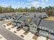 A high angle view reveals the layout of these modern townhomes, with their ample parking and neat landscaping at 486 Autumn Rain St, Cary, NC 27519