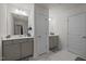 Bathroom with double vanity, storage cabinet, and tiled floors at 486 Autumn Rain St, Cary, NC 27519