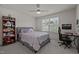 Bright bedroom with a ceiling fan, a large window with blinds and desk perfect for study at 486 Autumn Rain St, Cary, NC 27519