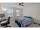 Bright bedroom featuring a ceiling fan, and large windows with blinds allowing natural light at 486 Autumn Rain St, Cary, NC 27519