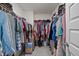 Walk-in closet showcasing ample storage space and organized hanging racks at 486 Autumn Rain St, Cary, NC 27519