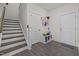 Welcoming entryway with staircase, storage, and access to the house at 486 Autumn Rain St, Cary, NC 27519