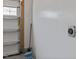 Image shows a clean and newly painted garage interior, featuring a garage door, electrical outlet, and broom at 486 Autumn Rain St, Cary, NC 27519