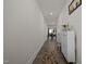 Hallway with wood floors leading to a dining area at 486 Autumn Rain St, Cary, NC 27519