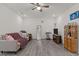 Spacious living room with neutral tones, ceiling fan, and hardwood floors at 486 Autumn Rain St, Cary, NC 27519
