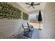 Covered back patio with a decorative wall, fan, and furniture at 486 Autumn Rain St, Cary, NC 27519