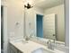Bathroom featuring double sinks with white quartz counters and a large mirror at 486 Traditions Grande Blvd # 28, Wake Forest, NC 27587