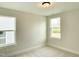 Bright bedroom with neutral carpet, two windows offering great natural light at 486 Traditions Grande Blvd # 28, Wake Forest, NC 27587