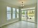 Bright dining area with ample natural light, open layout, and access to the outdoor space through sliding glass doors at 486 Traditions Grande Blvd # 28, Wake Forest, NC 27587