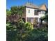Backyard features a screened porch, patio, outdoor seating, and lush landscaping at 502 Willowmere Ct, Cary, NC 27513