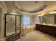 Bathroom features double vanity, glass shower, large soaking tub, and natural light at 502 Willowmere Ct, Cary, NC 27513