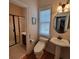 Bathroom with a stand-alone sink, modern toilet, and walk-in glass enclosed shower at 502 Willowmere Ct, Cary, NC 27513