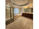 Bathroom features double vanity, glass shower, large soaking tub, and natural light at 502 Willowmere Ct, Cary, NC 27513