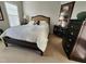 Cozy bedroom with a comfortable bed, bedside tables, and a dark wood dresser at 502 Willowmere Ct, Cary, NC 27513