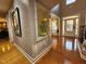 Elegant foyer featuring hardwood floors, niche with decorative vase, and front door view at 502 Willowmere Ct, Cary, NC 27513