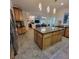 Open kitchen with island, stainless appliances, and views into the living room, perfect layout at 502 Willowmere Ct, Cary, NC 27513